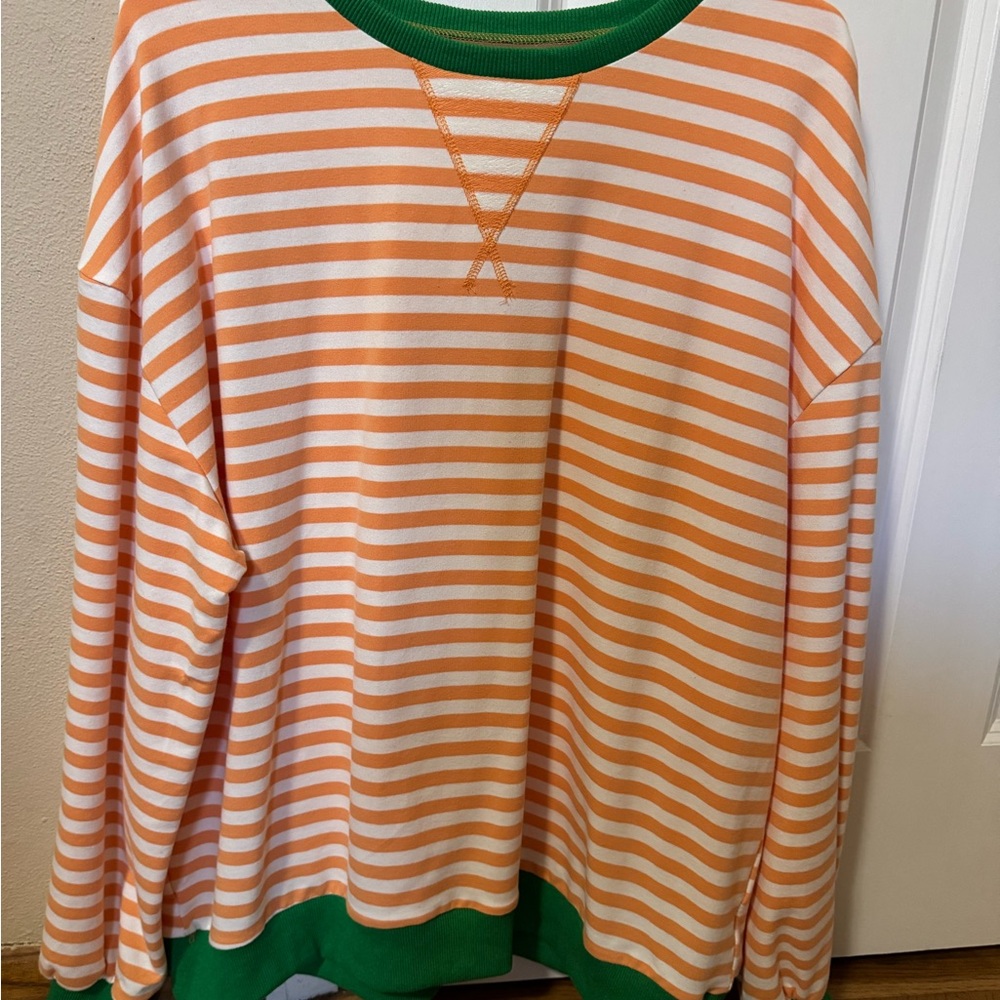 Striped Orange and White Sweatshirt with Green Accents